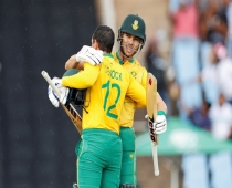 Record-breaking day: South Africa's Quinton de Kock (left) is congratulated by Reeza Hendricks 