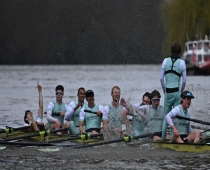 Cambridge University celebrate after their victory over Oxford University in the 168th men's boat race