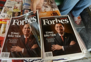 According to the company, the Forbes brand reaches more than 150 million people worldwide through its websites and events, with 45 editions covering 76 countries (a copy of the magazine's Vietnamese edition of Forbes Magazine is pictured June 2013)