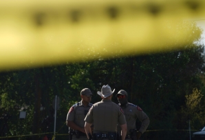Officers stand outside Robb Elementary School in Uvalde, Texas, on May 25, 2022 after the massacre