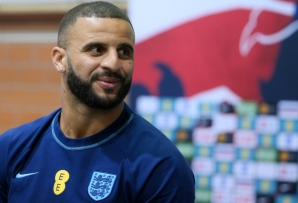 England defender Kyle Walker plays darts against a journalist at the team's World Cup training camp