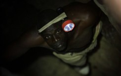 FILE: A gold miner works underground in Anka near Gusau, on December 4,2019. For generations, the mineral-rich earth of Nigeria's Zamfara state has provided families living here with a way to make ends meet.