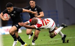 File: Japan's Michael Leitch tries to tackle New Zealand's Stephen Perofeta during the rugby union Test match between Japan and New Zealand’s All Blacks at the National Stadium in Tokyo on October 29, 2022. Philip FONG / AFP