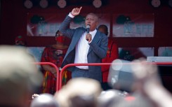 Economic Freedom Fighters (EFF) leader Julius Malema addresses his supporters outside the Randburg Magistrate Court, near Johannesburg, on October 13, 2020. 