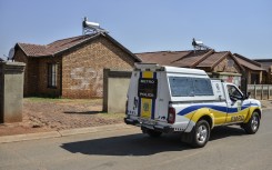 File: A police van patrols in front of the house where Orlando Pirate and Bafana Bafana goalkeeper Senzo Meyiwa was murdered in 2014 in Johannesburg. 