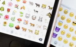 File: A picture shows emoji characters also known as emoticons on the screens of two mobile phones. MIGUEL MEDINA / AFP