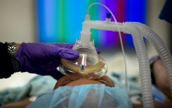 File: A anesthesiologist prepares a kidney donor in the operating room for a kidney transplant at Johns Hopkins Hospital June 26, 2012 in Baltimore, Maryland. The US Supreme Court is expected to announce their decision on the US President Barack Obama's healthcare law on June 28. AFP PHOTO/Brendan SMIALOWSKI