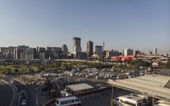 This aerial view shows the Johannesburg skyline and the Bree taxi rank in Newtown, Johannesburg, on May 7, 2020.