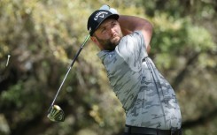 Top-ranked Jon Rahm of Spain lost his match but won his group Friday at the WGC Match Play, advancing to a Saturday knockout showdown against four-time major winner Brooks Koepka