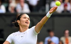 Emma Raducanu serves during her defeat to Caroline Garcia in the second round at Wimbledon