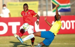 South Africa defender Mosa Lebusa (R) conceded an own goal in a 4-1 home defeat by Angola in an African Nations Championship qualifier