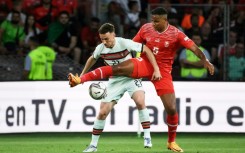 Manchester City's Swiss defender Manuel Akanji (R)