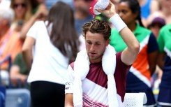 Hot work: Casper Ruud cools off during his win over Corentin Moutet