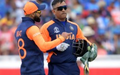 Virat Kohli (left) has revealed his former captain Mahendra Singh Dhoni (right) was the only player to send him mesages of support after giving up the Test captaincy