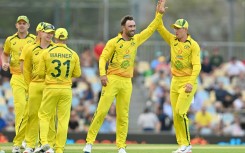 Australia's Glenn Maxwell (2nd R) celebrates his wicket of New Zealand's Kane Williamson