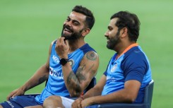 India's Virat Kohli (L) and Rohit Sharma sit for an interview at the end of the Asia Cup Super Four match in Dubai on Thursday