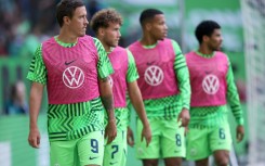 Wolfsburg's German forward Max Kruse (L) has been told his days are over at the club. 