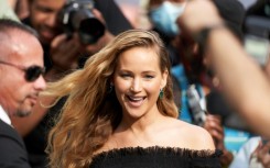 Jennifer Lawrence drew screaming fans to the red carpet for "Causeway," an indie drama in which she plays a military veteran 
