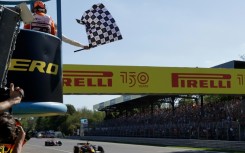 Max Verstappen crosses the line in Monza ahead of Ferrari's Charles Leclerc 