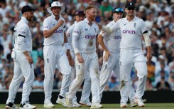 Leading from the front: England captain Ben Stokes (C) celebrates with teammates after he dismissed South Africa's Marco Jansen
