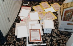 This undated file photo released by the US Department of Justice on August 31, 2022 shows a photo of documents allegedly seized at Donald Trump's Mar-a-Lago resort spread over a carpet