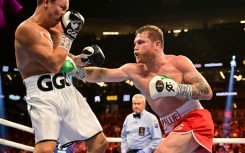 Mexican boxer Saul 'Canelo' Alvarez (R) goes for the body on the way to a unaimous decision over Kazakhstan's Gennady Golovkin in their super-middleweight world title fight