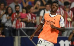 Vinicius Junior warms up in front of Atletico fans 