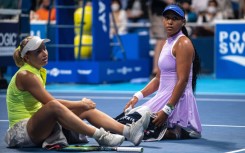Daria Saville (left) retired from her match with Naomi Osaka (right) at the Pan Pacific Open in Tokyo with a knee injury