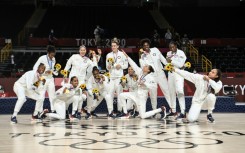 The USA celebrate their gold medals at the Tokyo Olympics. They could begin their bid to win a fourth straight women's basketball World Cup in Sydney with just seven players on court