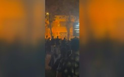 Protesters cheer as flames engulf governor’s office in northern Iran