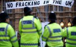 Protestors erected a mock gas fracking rig in front of Britain's Houses of Parliament in 2012