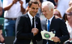 Roger Federer (left) and John McEnroe pictured at Wimbledon in 2022