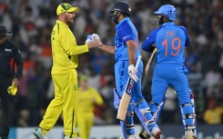 Australian captain Aaron Finch (left) congratulates his Indian counterpart Rohit Sharma 