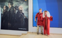 Amateur cosplayers pose at the entrance of Comic Con Africa