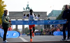 Kenya's Eliud Kipchoge crossing the line with a new world marathon record 