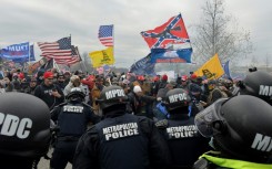 Supporters of former president Donald Trump clash with police and security forces as they storm the US Capitol on January 6, 2021  