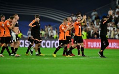 Shakhtar Donetsk players leave the pitch after a strong effort in their 2-1 defeat by Real Madrid.
