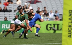 France's Laure Sansus runs the ball during their opening win
