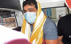 Indian Olympic medallist Sushil Kumar is escorted by police after his arrest in May last year