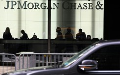 JPMorgan Chase reported lower quarterly profits as it set aside more funds in case of bad loans