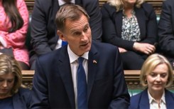 New finance minister Hunt told parliament Truss had agreed to reverse almost all the tax measures announced three weeks ago as the grim faced premier looked on