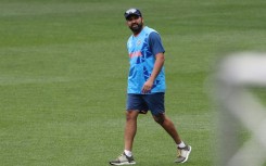 India's captain Rohit Sharma walks in the field before the start of a practice session