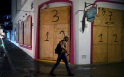 Businesses in the tourist area of Puerto Vallarta in Jalisco state, Mexico, boarded up shopfronts in preparation for Hurricane Roslyn's landfall