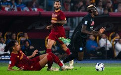 Napoli forward Victor Osimhen (R) is fouled by Roma defender Chris Smalling (L). 