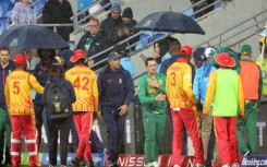 Zimbabwe and South Africa players shake hands after their match was washed out