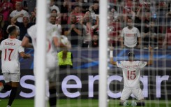 Sevilla's Moroccan forward Youssef En-Nesyri (R) celebrates scoring his team's first goal against Copenhagen