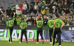 Ireland's players celebrate their famous win against England at the Melbourne Cricket Ground