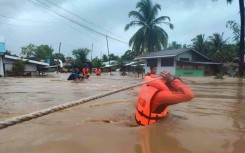 Tropical Storm Nalgae has unleashed flash floods and landslides in parts of the Philippines