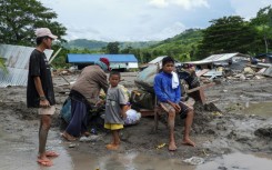 Fourteen bodies have been recovered from the village so far. They are among 40 confirmed deaths in a series of flash floods and landslides ahead of Nalgae's landfall