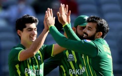 Pakistan's Naseem Shah (left) celebrates the wicket of Netherlands captain Scott Edwards with teammate Shadab Khan